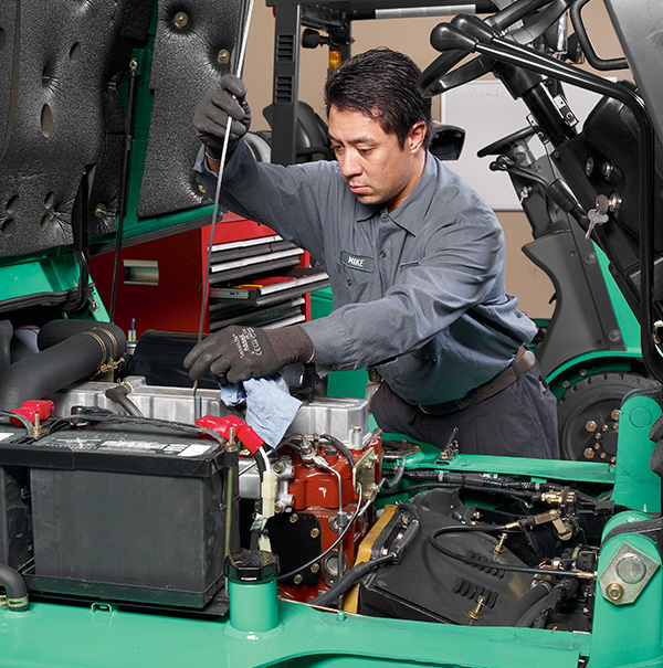 Service technician working on a Mitsubishi forklift